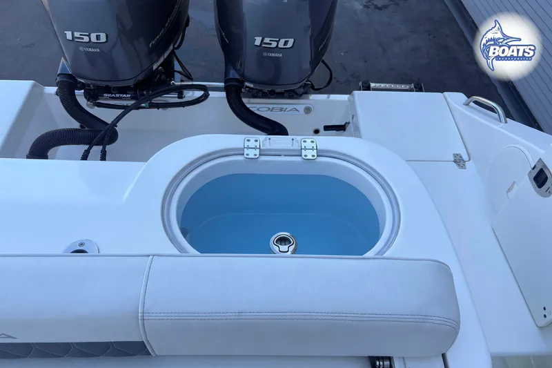 Slide: The Image of 2023 Cobia 262 Center Console boat with dual Yamaha 150 engines and livewell. - 12