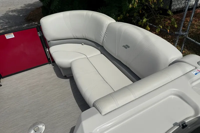 Slide: The Image of Luxurious seating on a 2017 Starcraft SLS 3 boat, featuring plush white upholstery. - 14