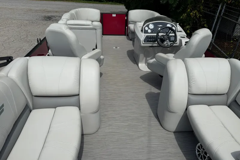 Slide: The Image of 2017 Starcraft SLS 3 boat interior with plush white seating and modern dashboard. - 13