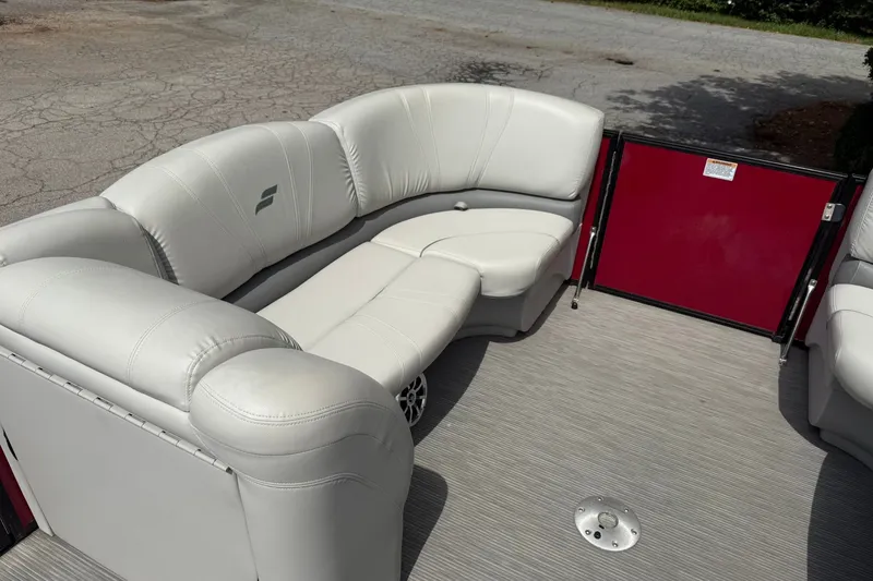 Slide: The Image of Luxurious seating on a 2017 Starcraft SLS 3 boat with white upholstery and red accents. - 15