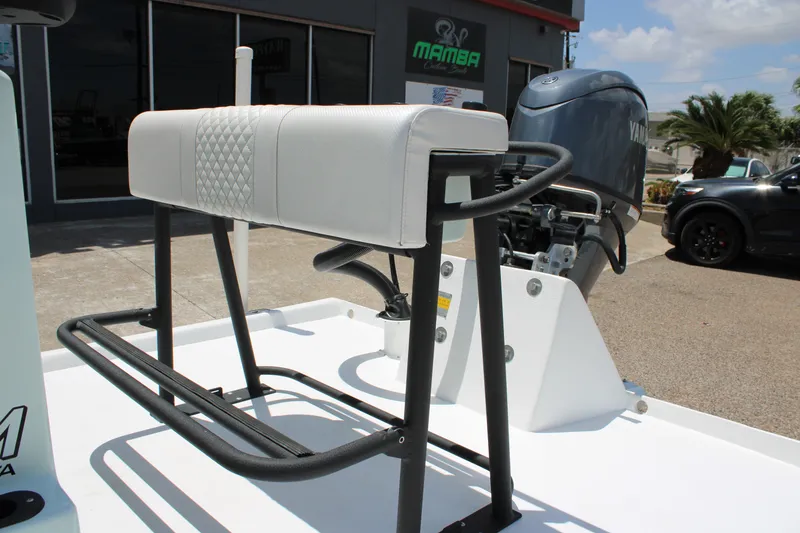 Slide: The Image of 2027 Freedom Boats Chiquita with Yamaha engine, featuring a sleek white seat and sturdy frame. - 15