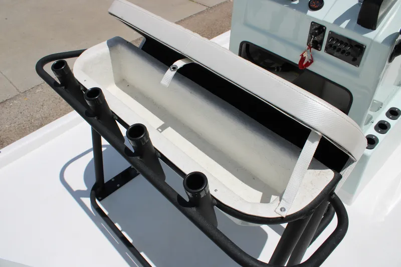Slide: The Image of 2027 Freedom Boats Chiquita with rod holders and storage compartment. - 13