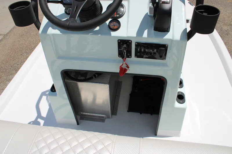 Slide: The Image of 2027 Freedom Boats Chiquita console with steering wheel and control panel. - 9