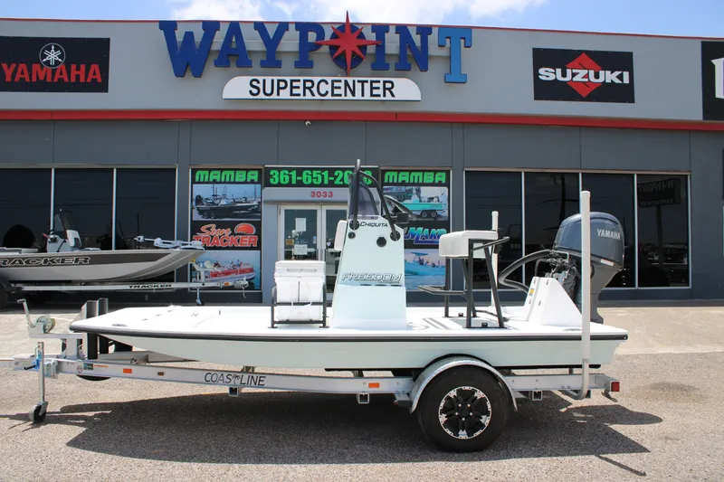 Slide: The Image of 2027 Freedom Boats Chiquita on trailer at Waypoint Supercenter dealership. - 1