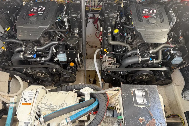 Slide: The Image of Twin MerCruiser 5.0 MPI engines in a 2008 Bayliner 300 boat engine compartment. - 20