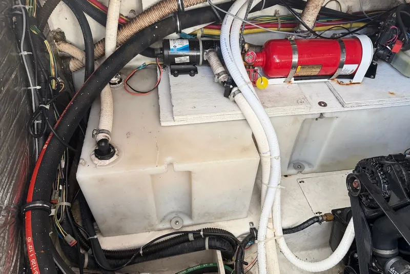 Slide: The Image of Engine compartment of a 2008 Bayliner 300 boat with fire extinguisher and wiring. - 23