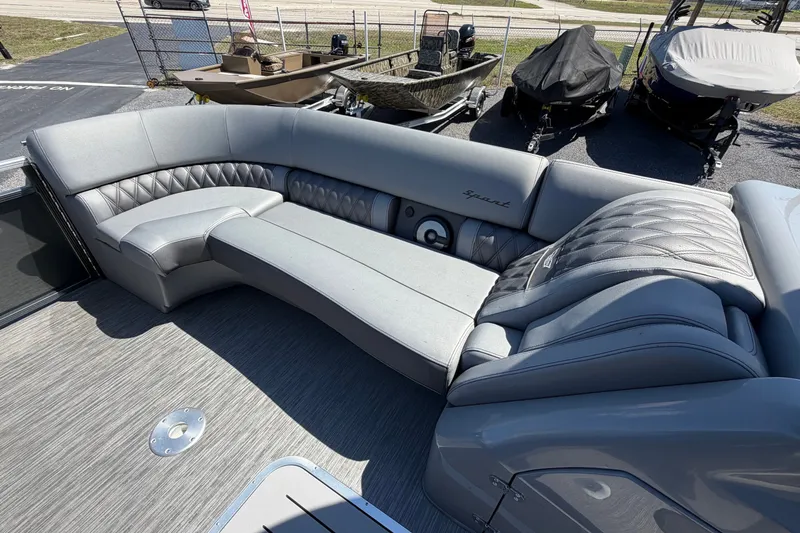Slide: The Image of 2022 Bennington 25 QX boat interior with luxurious gray seating and quilted design. - 16