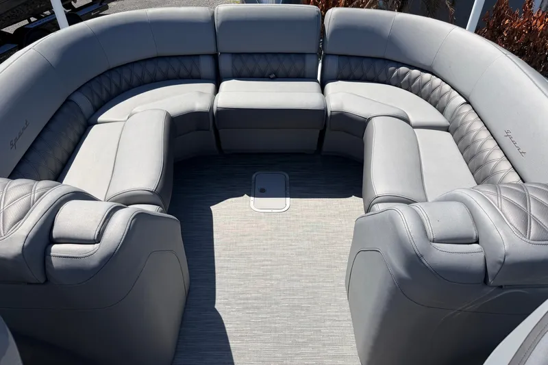 Slide: The Image of Luxurious seating on 2022 Bennington 25 QX boat, featuring elegant gray upholstery. - 25