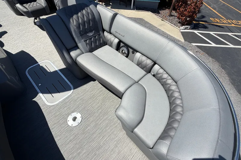 Slide: The Image of Luxurious seating on a 2022 Bennington 25 QX pontoon boat, featuring quilted upholstery. - 17