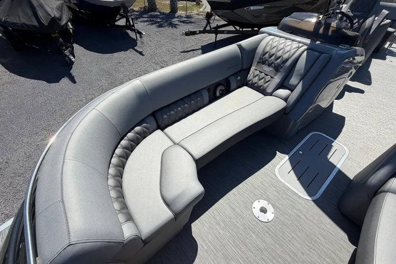 Slide: The Image of 2022 Bennington 25 QX boat interior with luxurious gray seating and modern design. - 18