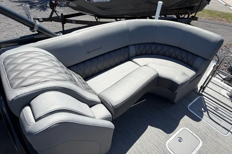 Slide: The Image of Luxurious seating on 2022 Bennington 25 QX boat, featuring elegant gray upholstery. - 23