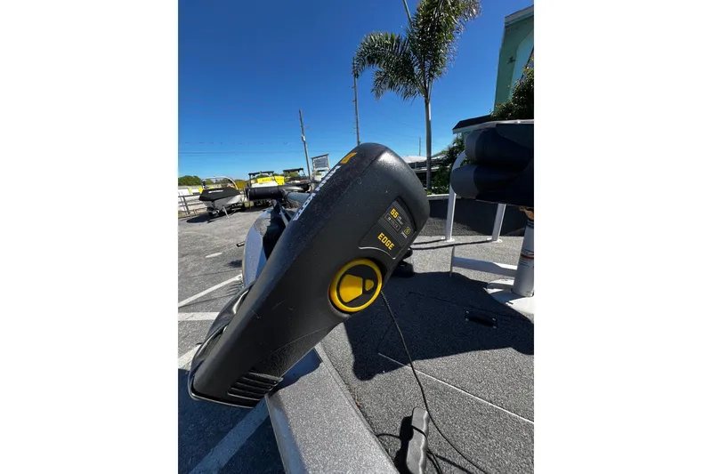 Slide: The Image of 2023 Crestliner 1600 Vision boat with trolling motor in sunny outdoor setting. - 12