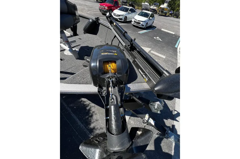 Slide: The Image of 2023 Crestliner 1600 Vision boat with Minn Kota trolling motor in parking lot. - 13