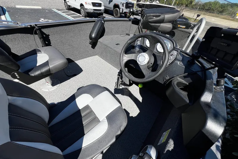Slide: The Image of Interior of 2023 Crestliner 1600 Vision boat with steering wheel and seats. - 8