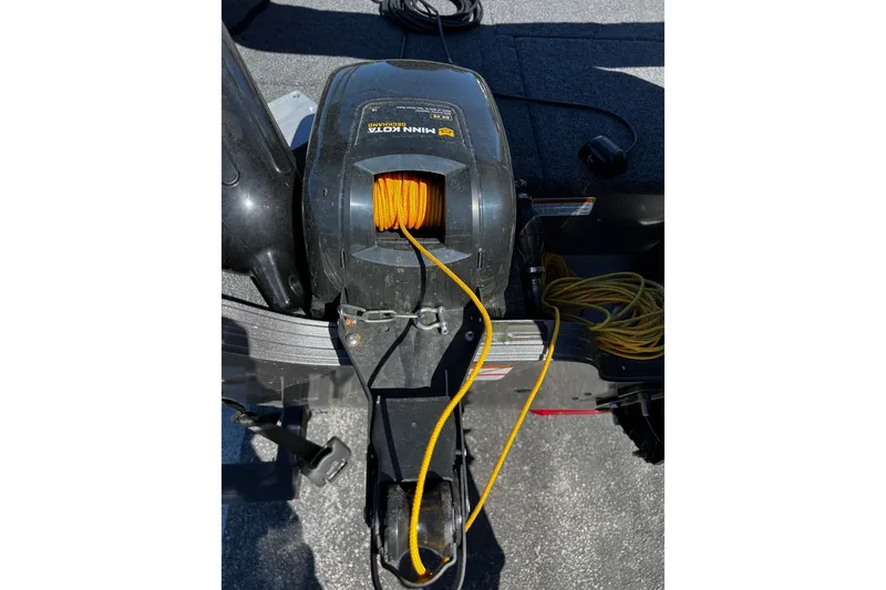 Slide: The Image of 2023 Crestliner 1600 Vision boat with Minn Kota trolling motor and yellow rope. - 7