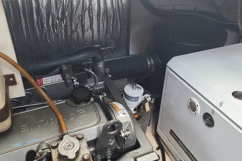 Slide: The Image of Engine room of 2006 Cruisers Yachts 370 Express, showcasing mechanical components. - 36