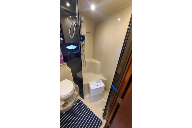 Slide: The Image of Bathroom interior of 2006 Cruisers Yachts 370 Express with shower and toilet. - 28