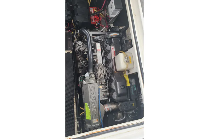 Slide: The Image of Engine compartment of a 2006 Cruisers Yachts 370 Express, showcasing mechanical components. - 32