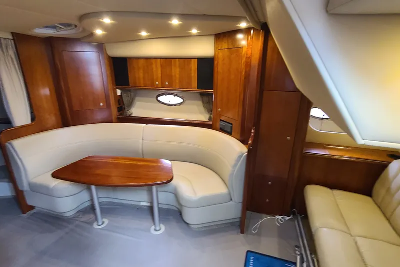 Slide: The Image of Luxurious interior of 2006 Cruisers Yachts 370 Express with elegant seating and wood finishes. - 19