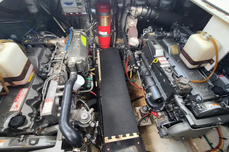 Slide: The Image of Engine room of a 2006 Cruisers Yachts 370 Express, showcasing dual engines and equipment. - 31