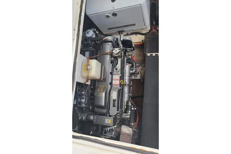 Slide: The Image of Engine compartment of a 2006 Cruisers Yachts 370 Express, showcasing mechanical components. - 33