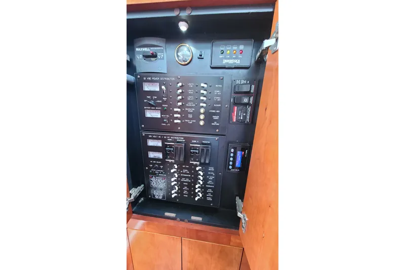 Slide: The Image of Electrical control panel of 2006 Cruisers Yachts 370 Express, featuring switches and gauges. - 30