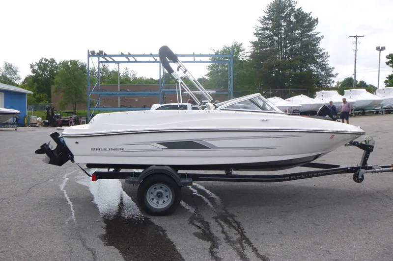 The Image of 2016 Bayliner 175 Bowrider on trailer in outdoor marina setting. - 1