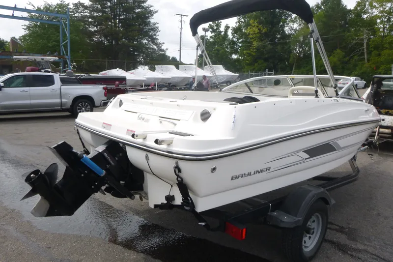 Slide: The Image of 2016 Bayliner 175 Bowrider boat on trailer in outdoor setting. - 2