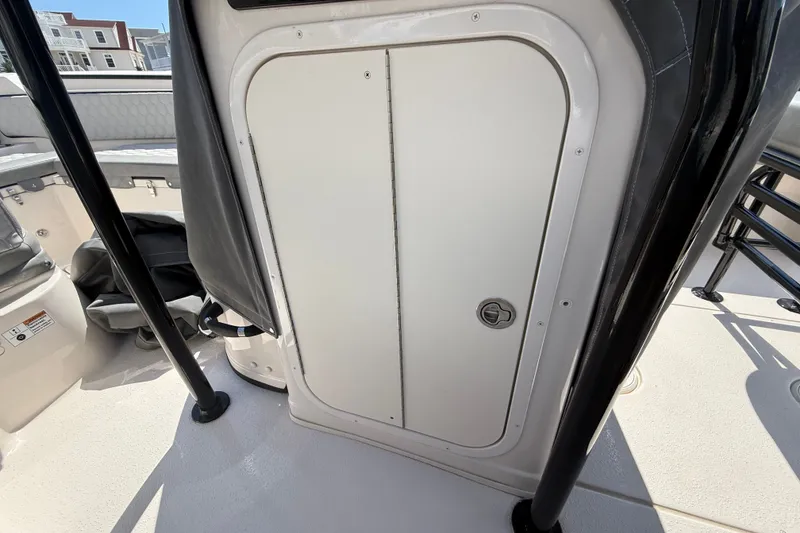 Slide: The Image of 2025 Sea Chaser 22 HFC boat interior with storage compartment and seating area. - 9