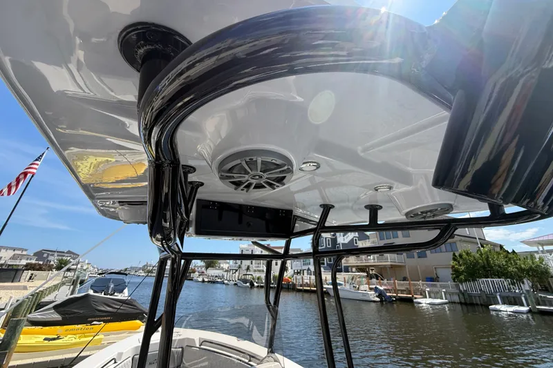 Slide: The Image of 2025 Sea Chaser 22 HFC boat with sleek design and modern features on a sunny day. - 4