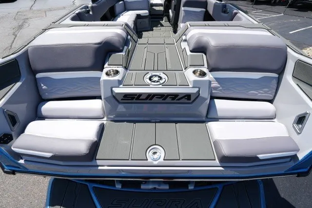 Slide: The Image of 2027 Supra SL boat interior with gray seating and modern design. - 18