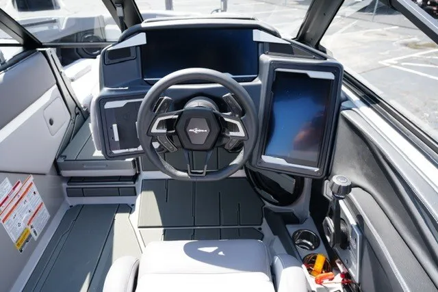 Slide: The Image of 2027 Supra SL boat cockpit with modern steering wheel and digital displays. - 15