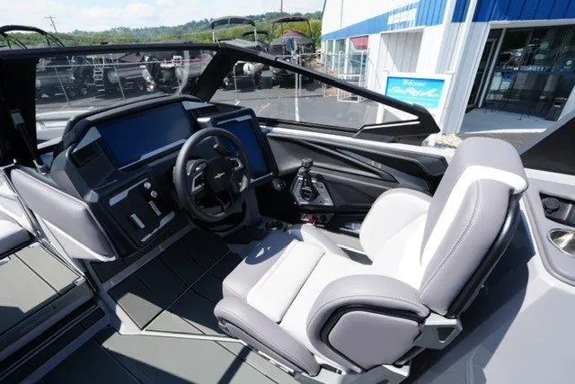 Slide: The Image of 2027 Supra SL boat cockpit with modern steering and controls, featuring sleek design and comfortable seating. - 14