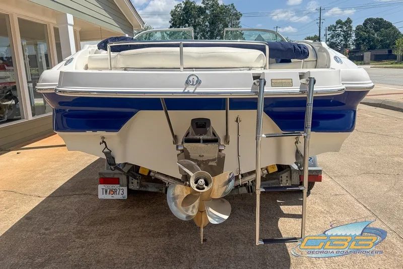 Slide: The Image of 2005 Monterey 228SI Montura Bowrider boat rear view with ladder and propeller. - 22