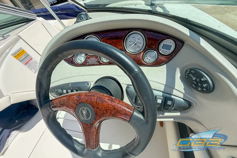 Slide: The Image of Steering wheel and dashboard of 2005 Monterey 228SI Montura Bowrider boat. - 20