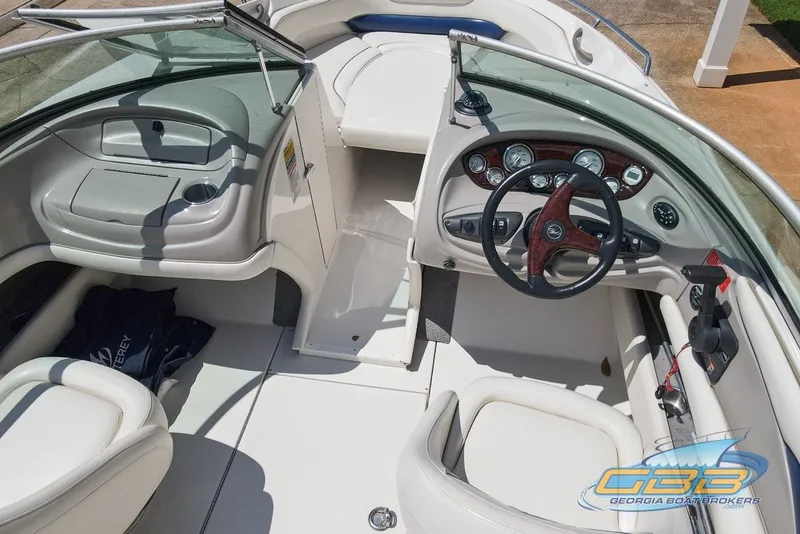 Slide: The Image of 2005 Monterey 228SI Montura Bowrider interior with steering wheel and dashboard controls. - 15