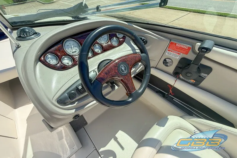 Slide: The Image of 2005 Monterey 228SI Montura Bowrider dashboard with steering wheel and gauges. - 19