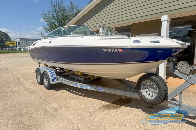 Slide: The Image of 2005 Monterey 228SI Montura Bowrider on trailer, displayed outdoors at Georgia Boat Brokers. - 10