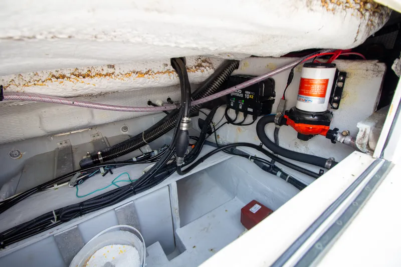 Slide: The Image of A view inside the engine compartment of a 2004 Grady-White Marlin 300 boat. - 26