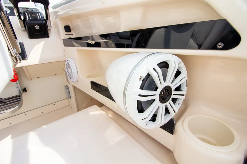 Slide: The Image of Close-up of a speaker and cup holder on a Grady-White Marlin 300 boat. - 34