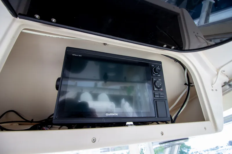 Slide: The Image of A Garmin navigation system is installed in a compartment on a Grady-White Marlin 300 boat. - 45