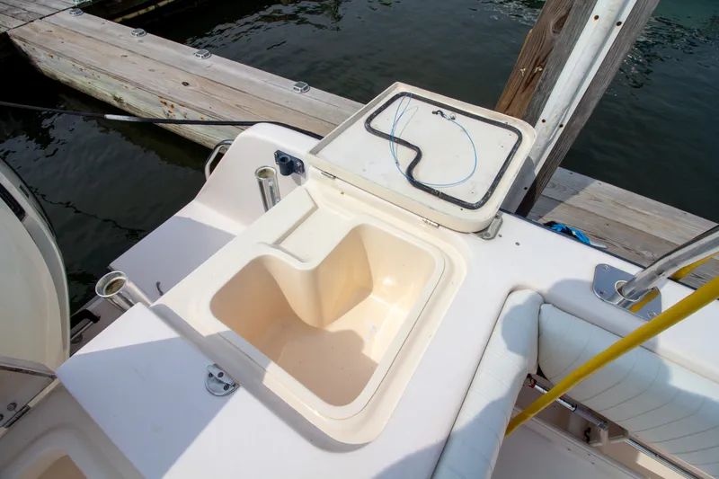 Slide: The Image of The image shows the cockpit of a 2004 Grady-White Marlin 300 with a sink. - 22