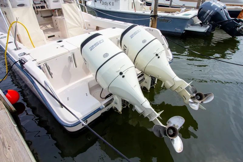 Slide: The Image of A 2004 Grady-White Marlin 300 with twin outboard engines at the dock. - 6