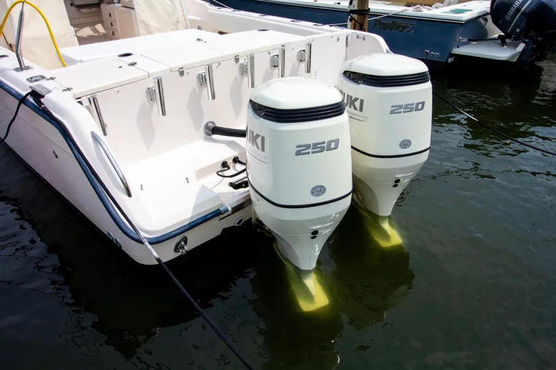 Slide: The Image of A 2004 Grady-White Marlin 300 with twin Suzuki 250 outboard engines in the water. - 7