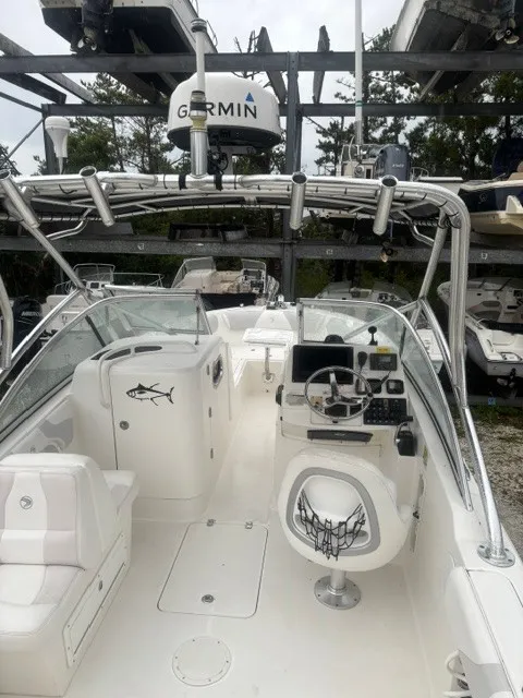 Slide: The Image of The image shows the cockpit of a 2010 Edgewater 245CX Crossover boat with a Garmin radar. - 6