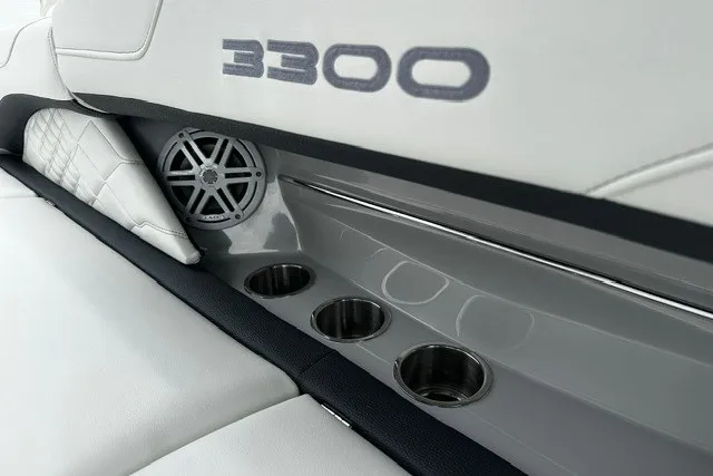 Slide: The Image of 2027 Regal 3300 boat interior with speaker and cup holders. - 35