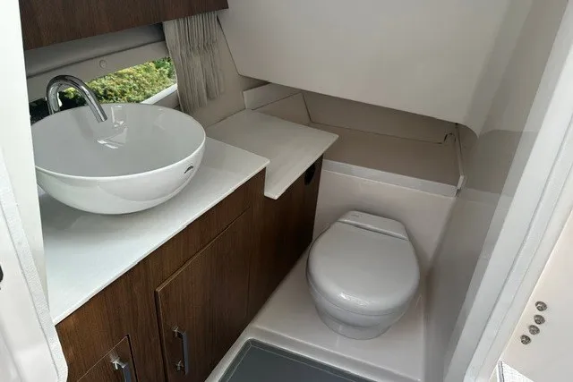 Slide: The Image of Modern bathroom in 2027 Regal 3300 boat with sink and toilet. - 19