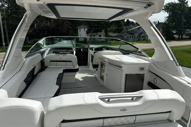 Slide: The Image of Luxurious 2027 Regal 3300 boat interior with sleek white seating and modern amenities. - 8