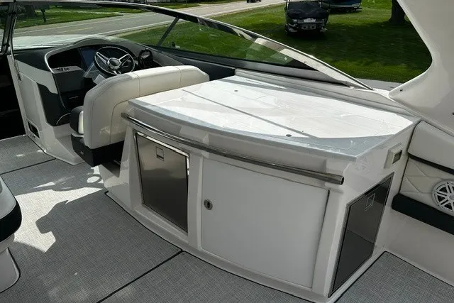 Slide: The Image of 2027 Regal 3300 boat interior with sleek helm and modern amenities. - 9