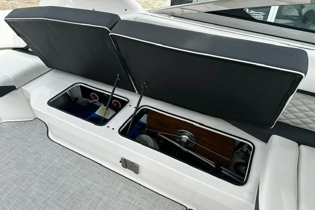 Slide: The Image of Open storage compartments on a 2027 Regal 3300 boat, showcasing interior features. - 23